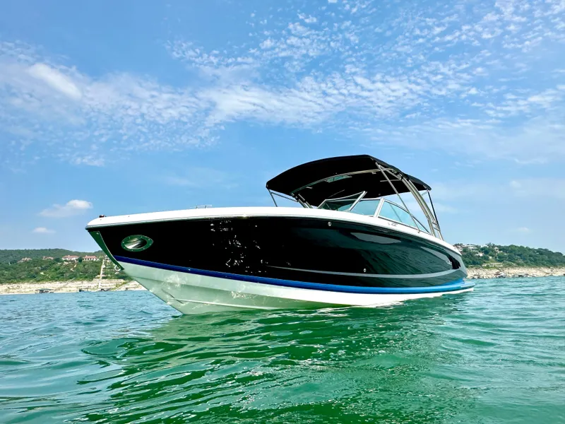 Slide: The Image of 2012 Cobalt A28 boat on water under clear blue sky. - 3