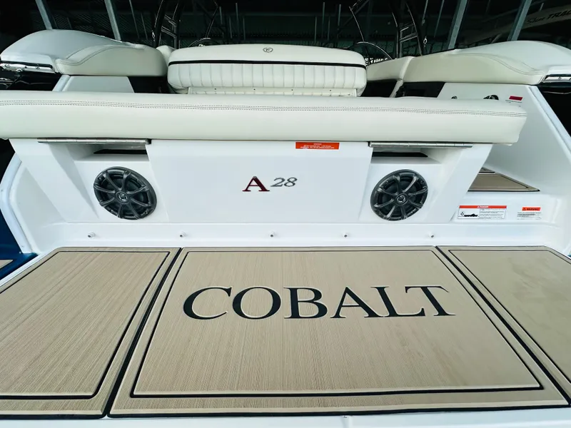 Slide: The Image of 2012 Cobalt A28 boat interior with logo and speakers on deck. - 30