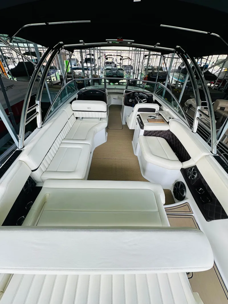 Slide: The Image of 2012 Cobalt A28 boat interior with white seating and modern design. - 32