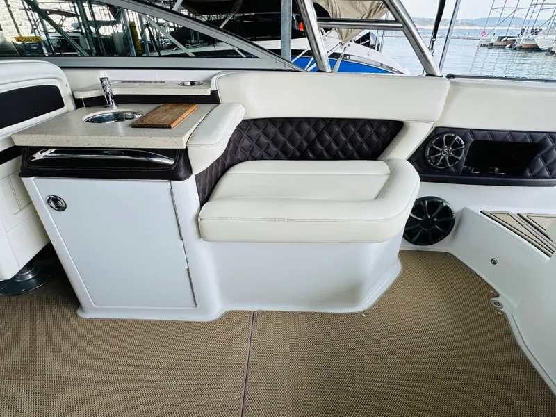 Slide: The Image of Luxurious interior of a 2012 Cobalt A28 boat with plush seating and sleek design. - 33