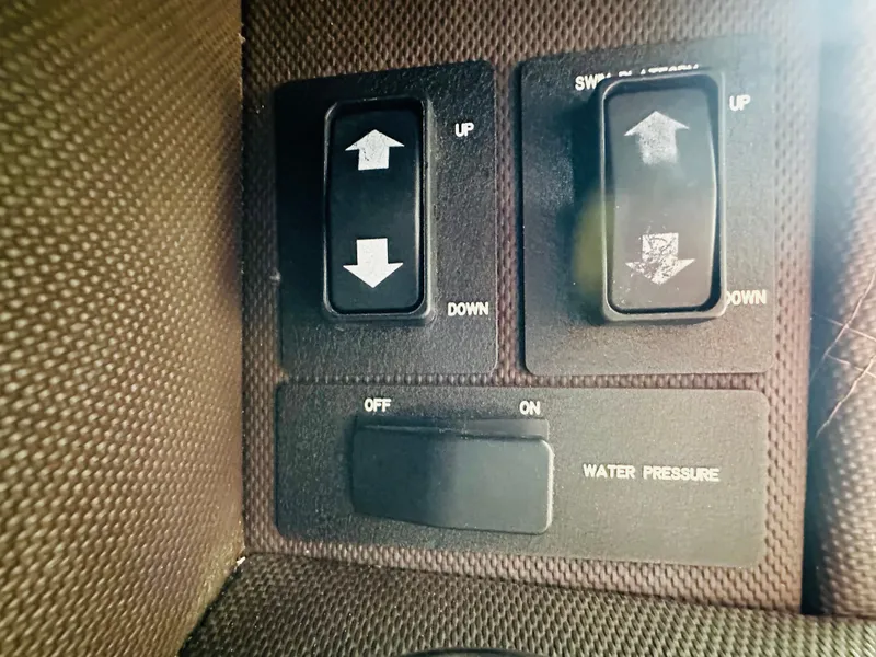 Slide: The Image of Control panel with switches for water pressure and directional adjustments on a 2012 Cobalt A28. - 34