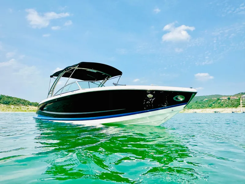 Slide: The Image of 2012 Cobalt A28 boat on clear water under a sunny sky. - 4