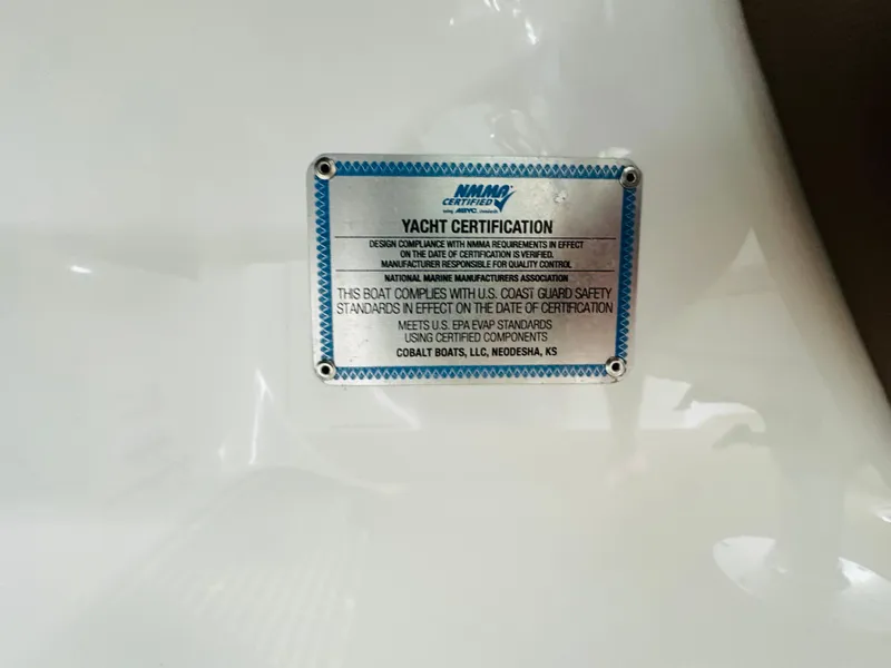 Slide: The Image of Yacht certification plaque on 2012 Cobalt A28, detailing compliance with safety standards. - 42