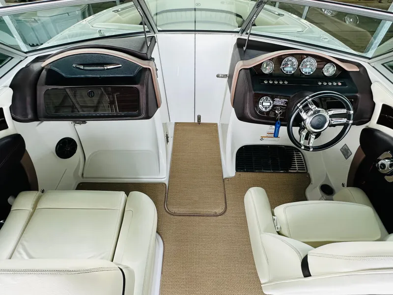 Slide: The Image of Interior of 2012 Cobalt A28 boat with steering wheel and dashboard controls. - 44