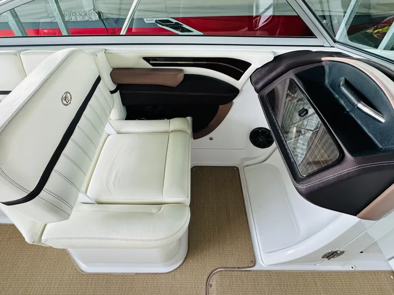 Slide: The Image of Interior of a 2012 Cobalt A28 boat with white leather seating and modern design. - 45