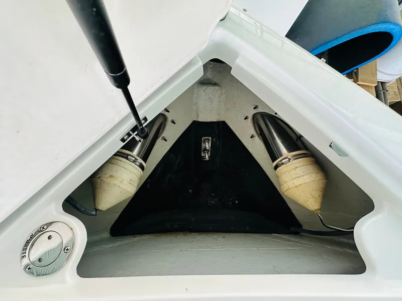 Slide: The Image of 2012 Cobalt A28 boat storage compartment with hydraulic lift and stainless steel fittings. - 49