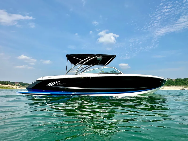 Slide: The Image of 2012 Cobalt A28 boat on clear water under a blue sky. - 5