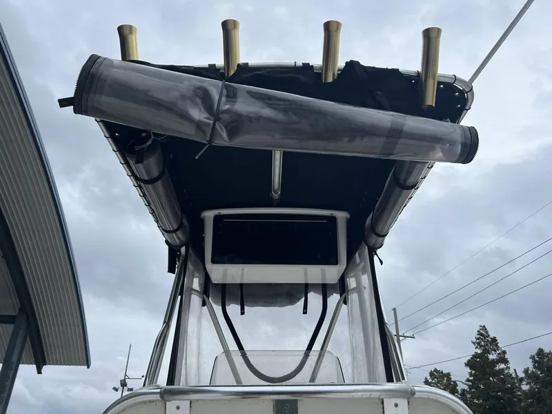 Slide: The Image of 2005 ProKat Bay Kat boat with rod holders and canopy, viewed from below. - 10