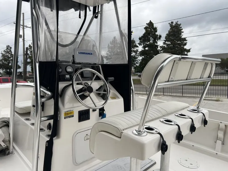 Slide: The Image of 2005 ProKat Bay Kat boat interior with steering wheel and seating. - 11