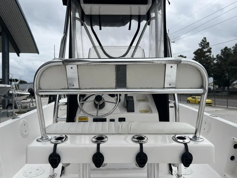 Slide: The Image of 2005 ProKat Bay Kat boat interior with steering wheel and rod holders. - 14