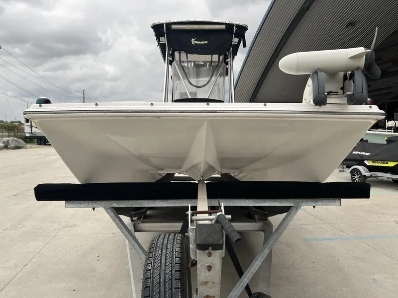 Slide: The Image of 2005 ProKat Bay Kat boat on trailer, front view under cloudy sky. - 4