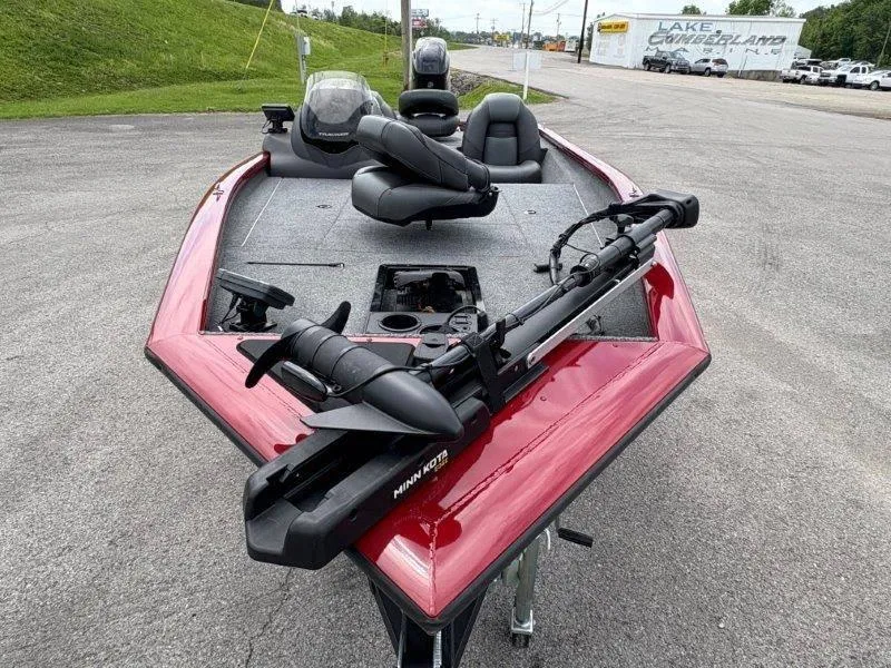 Slide: The Image of 2019 Tracker Pro Team 175 boat with Minn Kota trolling motor, parked on pavement. - 13