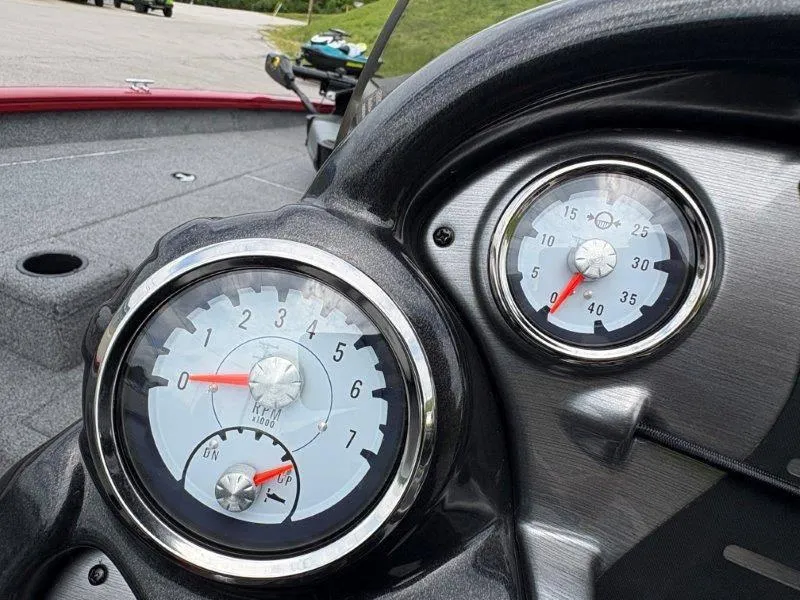 Slide: The Image of Dashboard of 2019 Tracker Pro Team 175 boat with gauges. - 16