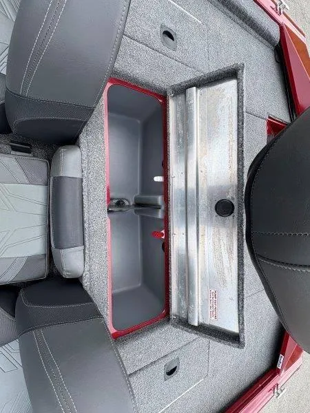 Slide: The Image of 2019 Tracker Pro Team 175 boat interior storage compartment with gray seating. - 17