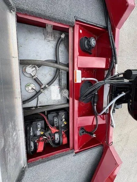 Slide: The Image of 2019 Tracker Pro Team 175 boat battery compartment with wiring and components. - 19