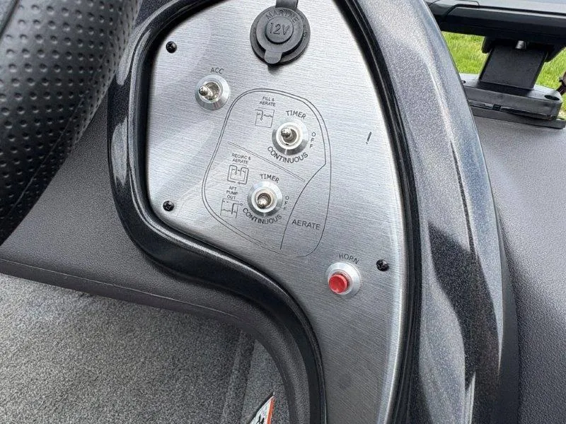 Slide: The Image of Control panel of 2019 Tracker Pro Team 175 boat with switches and 12V outlet. - 22