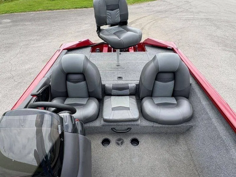 Slide: The Image of 2019 Tracker Pro Team 175 boat interior with gray seating and red accents. - 25