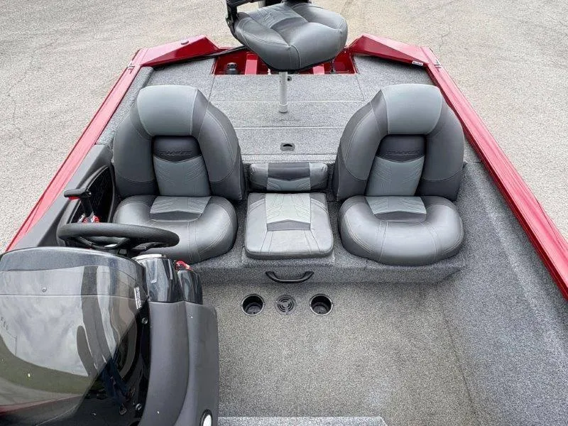 Slide: The Image of 2019 Tracker Pro Team 175 boat interior with gray seating and red accents. - 28