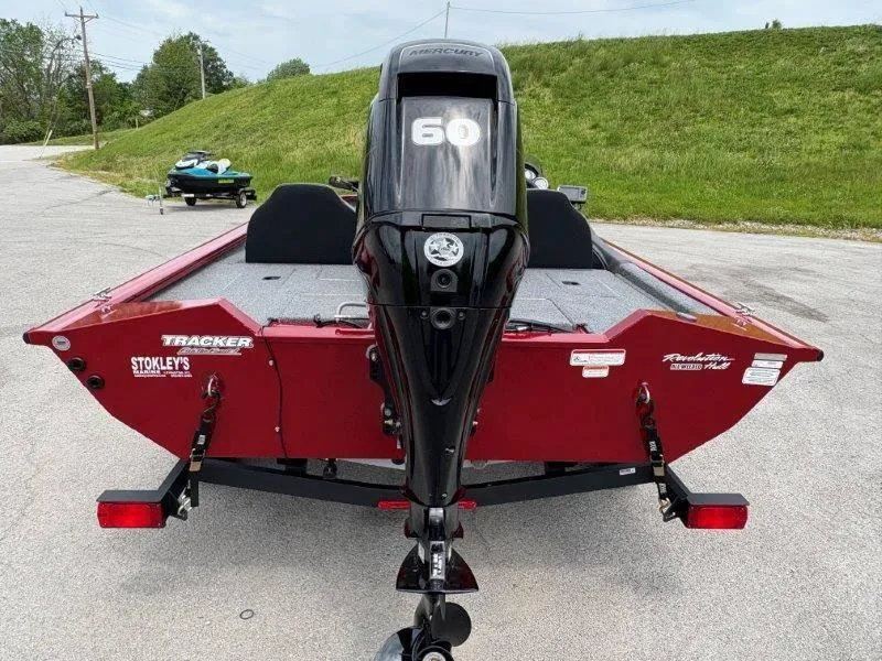Slide: The Image of 2019 Tracker Pro Team 175 boat with Mercury 60 engine, parked on a road. - 3