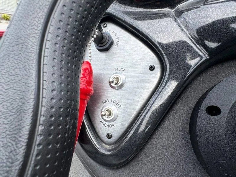 Slide: The Image of 2019 Tracker Pro Team 175 dashboard with bilge and nav light switches. - 33