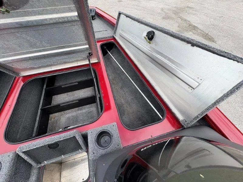 Slide: The Image of 2019 Tracker Pro Team 175 boat storage compartments open, showcasing interior space. - 36