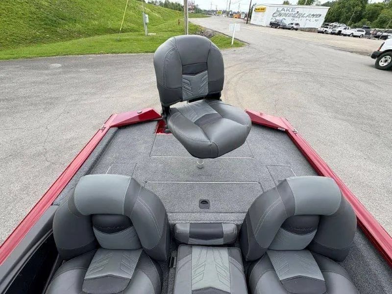 Slide: The Image of 2019 Tracker Pro Team 175 boat interior with gray seating and red accents. - 39