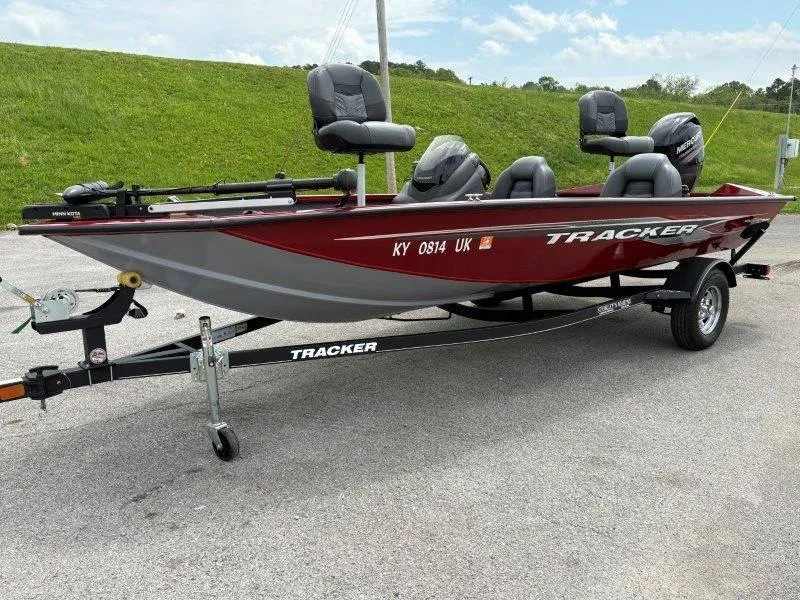 Slide: The Image of 2019 Tracker Pro Team 175 boat on trailer, red and gray, parked on pavement. - 47