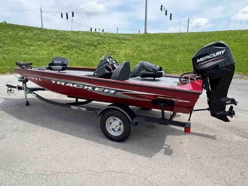 Slide: The Image of 2019 Tracker Pro Team 175 boat with Mercury engine on trailer, parked outdoors. - 5