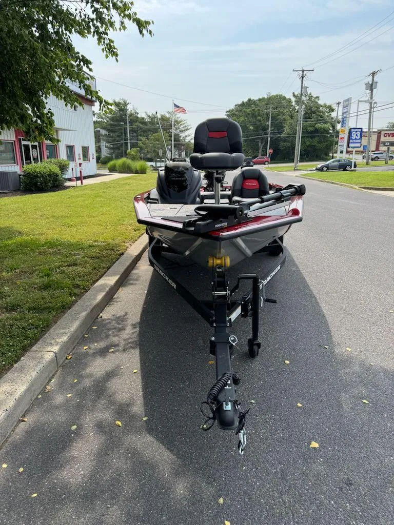 Slide: The Image of 2025 Tracker Pro Team 175 boat on trailer, parked on roadside. - 5