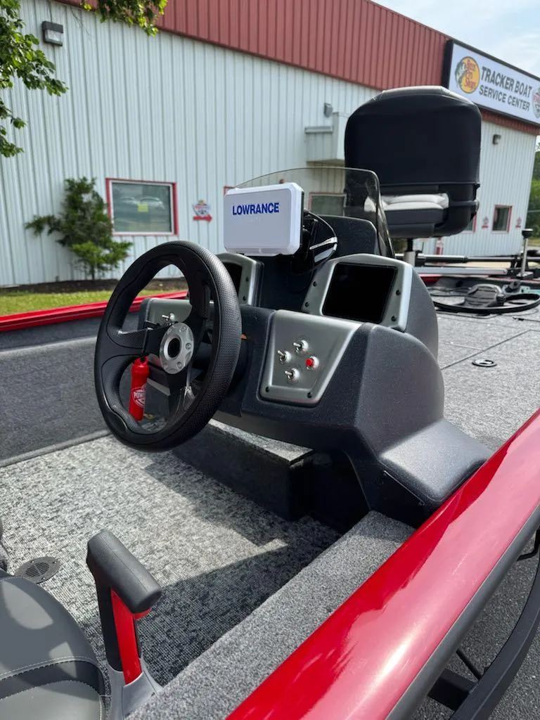 Slide: The Image of 2025 Tracker Pro Team 175 boat interior with steering wheel and Lowrance device. - 8