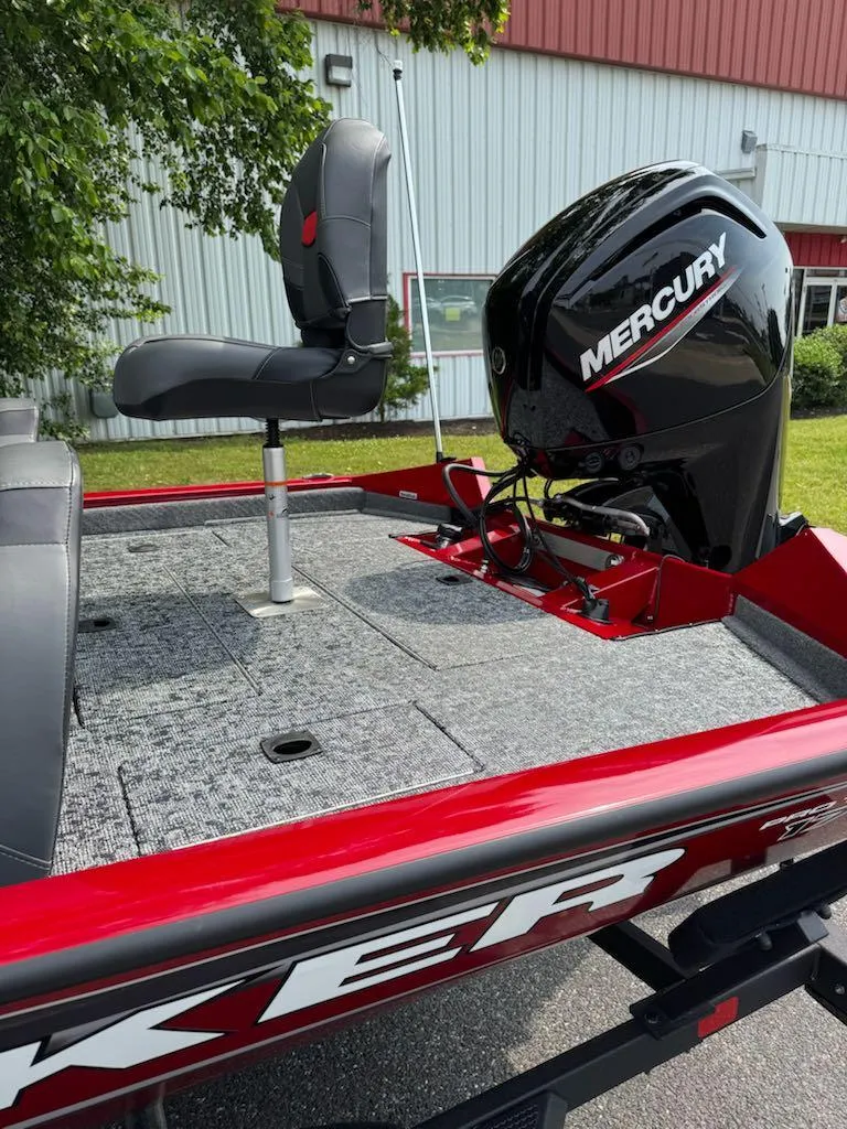 Slide: The Image of 2025 Tracker Pro Team 175 boat with Mercury engine, red and gray design. - 9
