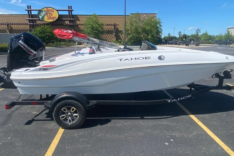 The Image of 2025 Tahoe T16 boat on trailer in parking lot near Bass Pro Shops. - 0