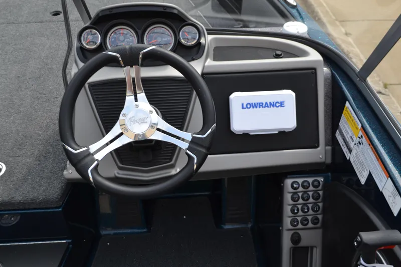 Slide: The Image of 2025 Ranger 1880MS boat dashboard with steering wheel and Lowrance navigation system. - 5