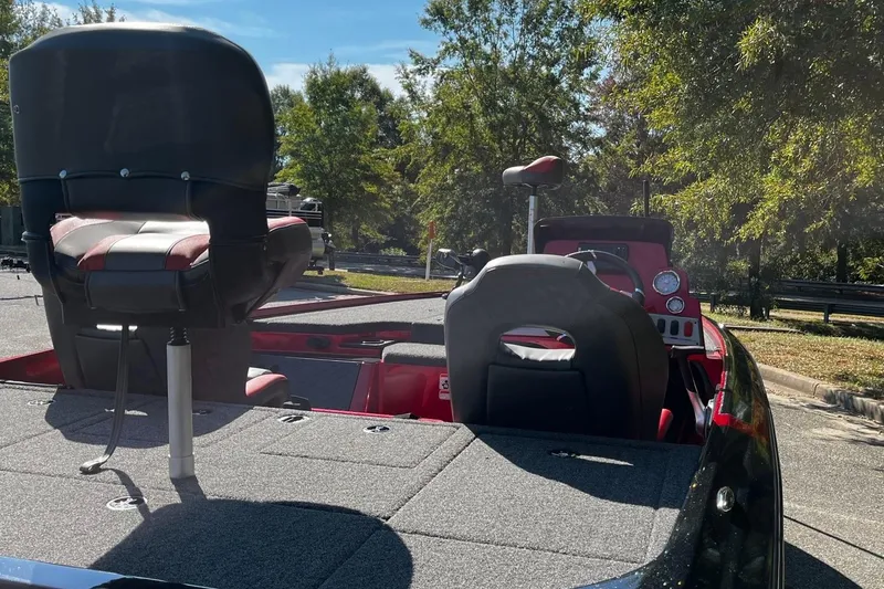 Slide: The Image of 2025 Nitro Z19 boat interior with seating and control panel, parked outdoors. - 5