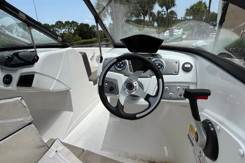Slide: The Image of Interior view of 2025 Tahoe 200 S boat cockpit with steering wheel and controls. - 4