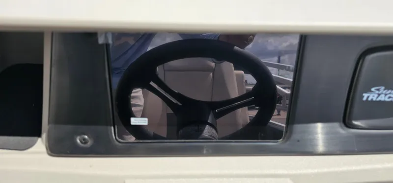 Slide: The Image of Steering wheel of a 2025 Sun Tracker Party Barge 20 DLX pontoon boat. - 12