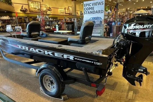 The Image of 2025 Tracker Panfish 17 boat with Mercury engine displayed indoors. - 0