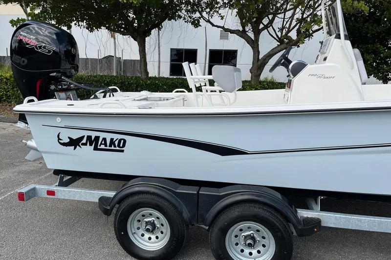 Slide: The Image of 2024 Mako Pro Skiff 19 CC boat on trailer with Mercury engine. - 4