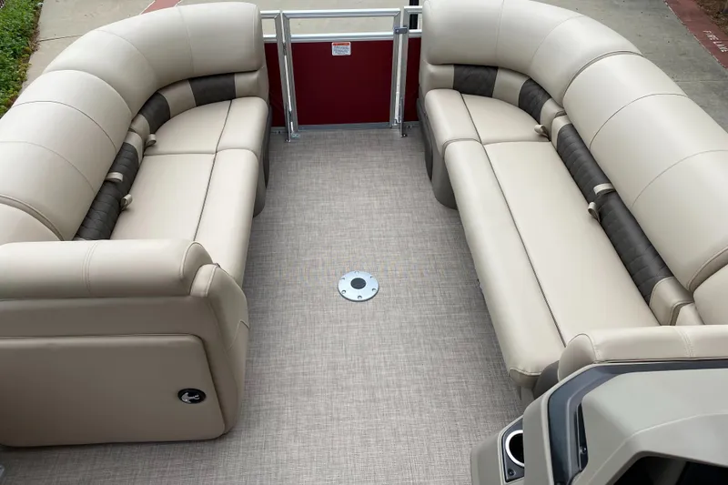 Slide: The Image of 2025 Sun Tracker Party Barge 22 DLX interior with beige seating and spacious layout. - 3