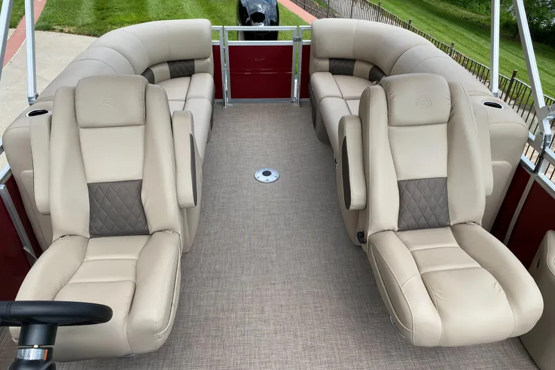 Slide: The Image of 2025 Sun Tracker Party Barge 22 DLX interior with beige seating and spacious layout. - 4
