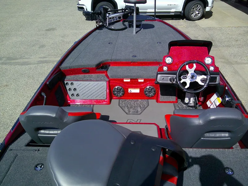 Slide: The Image of 2025 Nitro Z20 XL boat interior with steering wheel and seating. - 3
