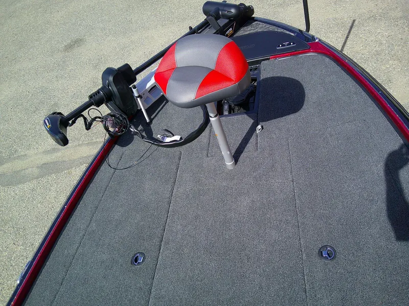 Slide: The Image of 2025 Nitro Z20 XL boat deck with red-gray seat and trolling motor. - 5