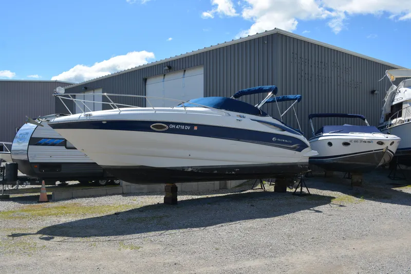 Slide: The Image of 2004 Crownline 270 CR boat on display outside a storage facility. - 10