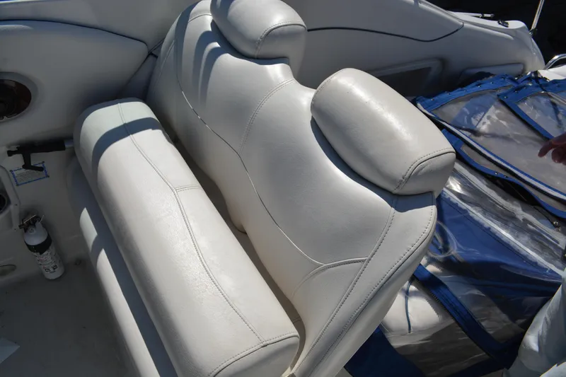 Slide: The Image of 2004 Crownline 270 CR boat interior with white leather seating. - 17