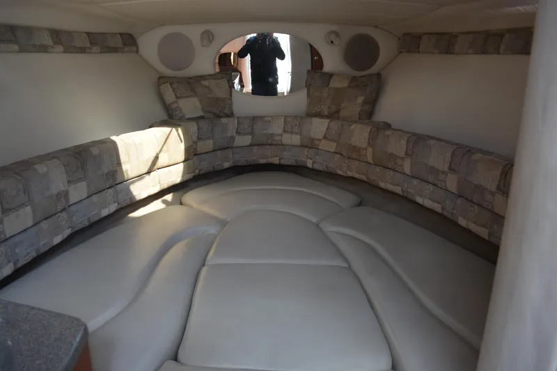 Slide: The Image of Interior of 2004 Crownline 270 CR boat with cushioned seating and modern design. - 23