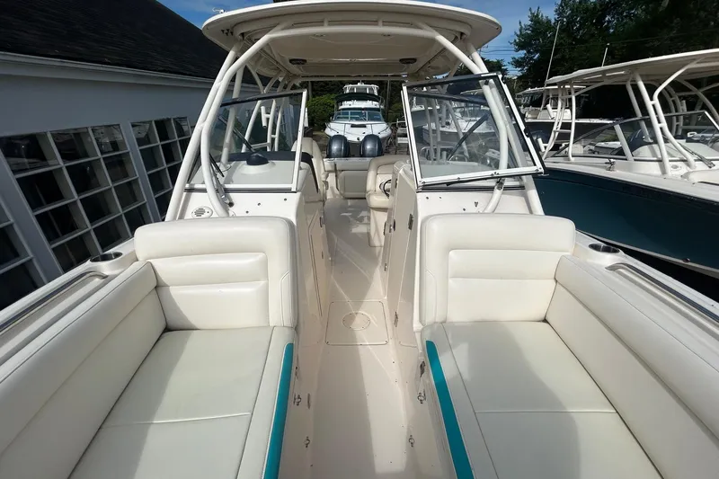 Slide: The Image of 2017 Grady-White Freedom 275 boat interior with spacious seating and open deck layout. - 13