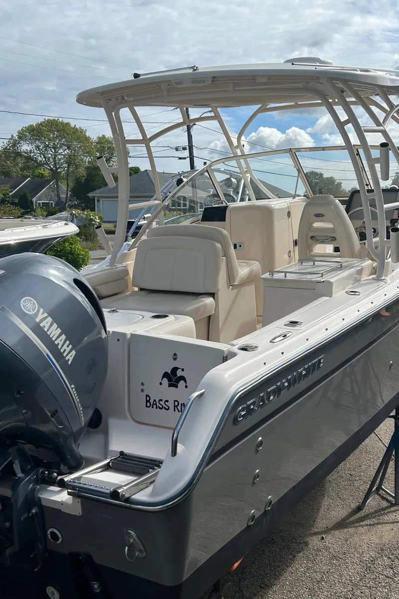 Slide: The Image of 2017 Grady-White Freedom 275 boat with Yamaha engine, docked outdoors. - 7