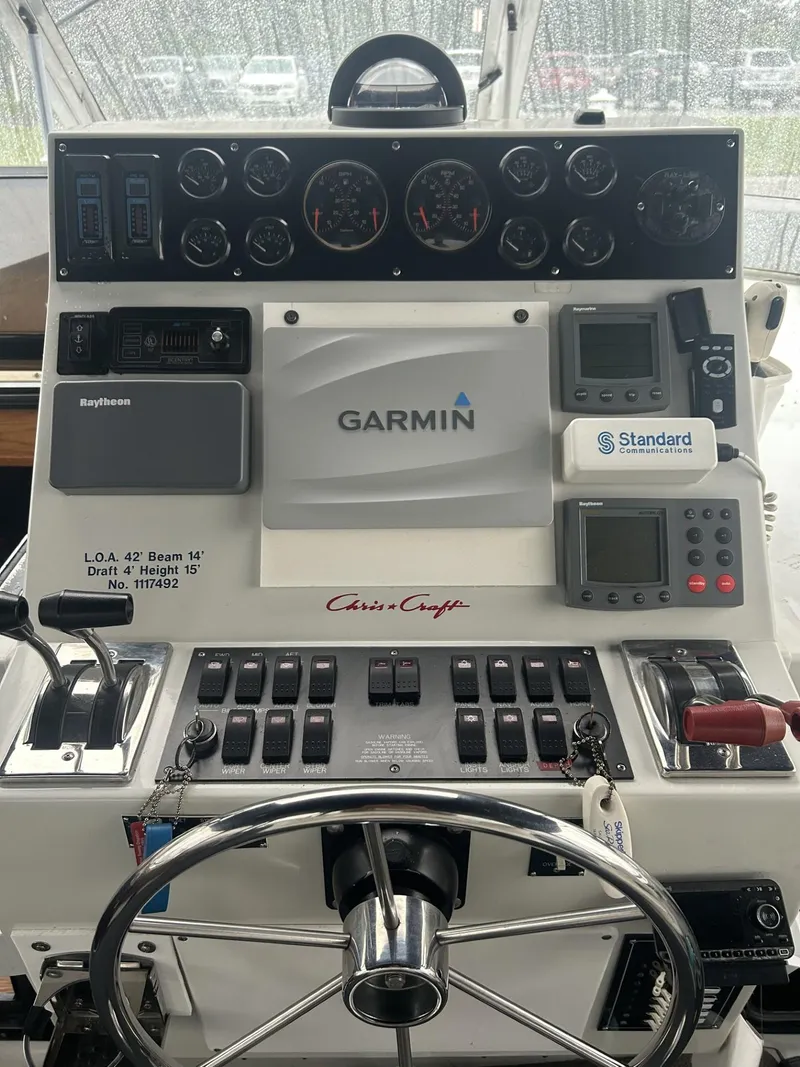 Slide: The Image of 1988 Chris-Craft 381 Catalina helm with Garmin navigation and control panel. - 11