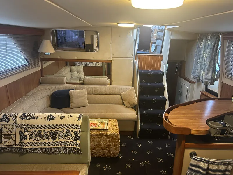 Slide: The Image of Interior of 1988 Chris-Craft 381 Catalina yacht with cozy seating and elegant decor. - 15