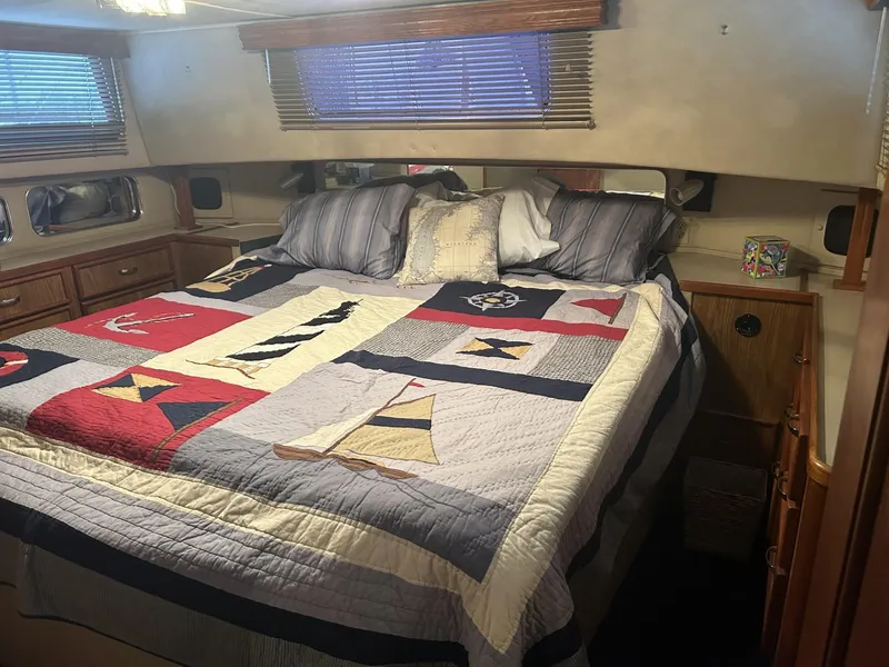 Slide: The Image of Cozy bedroom in 1988 Chris-Craft 381 Catalina yacht with nautical-themed bedding. - 20